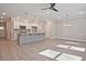 Open-concept space featuring a kitchen with modern island, and hardwood floors throughout at 691 Sunstone Ln, Lawrenceville, GA 30043