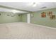 A spacious carpeted basement with neutral tones and decor at 775 N Ola N Rd, Mcdonough, GA 30252