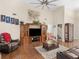 Comfortable living room featuring high ceilings, a large television, and modern, inviting furniture at 775 N Ola N Rd, Mcdonough, GA 30252