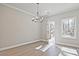 Dining room featuring hardwood floors and an elegant chandelier at 689 Sunstone Ln, Lawrenceville, GA 30043