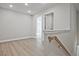 Open hallway with luxury vinyl plank flooring and natural lighting at 689 Sunstone Ln, Lawrenceville, GA 30043
