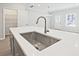 Close up of the kitchen island and sink with a modern faucet at 689 Sunstone Ln, Lawrenceville, GA 30043