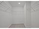 Large walk-in closet with ample shelving, ready for organized storage at 689 Sunstone Ln, Lawrenceville, GA 30043
