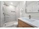 Contemporary bathroom with marble shower and wood vanity at 1382 Almont Sw Dr, Atlanta, GA 30310