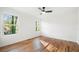 Well-lit bedroom with hardwood floors and two large windows at 1382 Almont Sw Dr, Atlanta, GA 30310