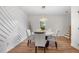 Elegant dining room with a round table and white accent wall at 1382 Almont Sw Dr, Atlanta, GA 30310