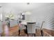 Modern dining room with white accent wall and hardwood floors at 1382 Almont Sw Dr, Atlanta, GA 30310