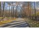 Long driveway lined with trees leading to a private estate at 6740 Mountain Lake Ln, Cumming, GA 30028