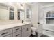 Modern bathroom with double vanity, sleek fixtures, and ample natural light at 241 Hembree Drive, Canton, GA 30115