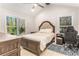 Cozy bedroom with ample natural light, vaulted ceilings, and neutral decor at 241 Hembree Drive, Canton, GA 30115