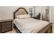Comfortable bedroom featuring a tufted headboard bed and soft, neutral bedding at 241 Hembree Drive, Canton, GA 30115