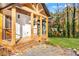 Charming home with a wooden front porch and metal railing, nestled amongst trees at 241 Hembree Drive, Canton, GA 30115