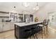 Modern kitchen with an island, stainless steel appliances, and bar stool seating for a cozy design at 241 Hembree Drive, Canton, GA 30115
