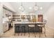 Modern kitchen featuring a large island with barstool seating, stainless steel appliances, and modern lighting at 241 Hembree Drive, Canton, GA 30115