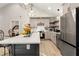Modern kitchen featuring a large island, stainless steel appliances, and an open view to the bedroom at 241 Hembree Drive, Canton, GA 30115
