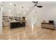 Spacious open-concept living room with modern lighting fixtures and hardwood floors at 241 Hembree Drive, Canton, GA 30115
