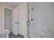 Bathroom with glass-door shower and closet at 687 Sunstone Ln, Lawrenceville, GA 30043