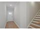 Welcoming foyer with wood-look flooring and staircase at 687 Sunstone Ln, Lawrenceville, GA 30043