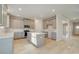 Open concept kitchen with island and gray cabinets at 117 Belvedere Rd, Mcdonough, GA 30253