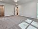 Large bedroom with plush carpet and a doorway that enters into an ensuite bathroom at 685 Sunstone Ln, Lawrenceville, GA 30043