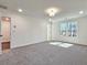 Spacious bedroom with plush carpeting and plenty of natural light from a large window at 685 Sunstone Ln, Lawrenceville, GA 30043