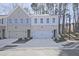 Charming townhome featuring a brick facade, a two-car garage, and well-maintained landscaping at 685 Sunstone Ln, Lawrenceville, GA 30043