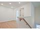 Hallway with wood floors, neutral walls, and white trim at 685 Sunstone Ln, Lawrenceville, GA 30043