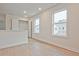 Bright hallway features hardwood flooring, two windows, and open railing at 685 Sunstone Ln, Lawrenceville, GA 30043