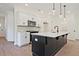 Modern kitchen with a large center island, stainless steel appliances, and pendant lighting at 685 Sunstone Ln, Lawrenceville, GA 30043