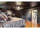 Spacious main bedroom with dark walls, hardwood floors, and a ceiling fan at 1445 Sheridan Ne Walk, Atlanta, GA 30324