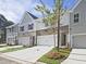 Modern townhouses with attached garages and landscaping at 709 Trevett Way, Marietta, GA 30062