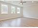 Bright living room with hardwood floors and large windows offering natural light at 709 Trevett Way, Marietta, GA 30062