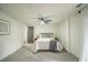 Bright bedroom with carpeted floor, ceiling fan, and ample natural light at 599 Quillian Ave., Decatur, GA 30032