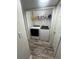 Basement laundry room features washer, dryer, and shelving at 6365 Wellington Walk Way, Lithonia, GA 30058