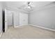 Bright bedroom featuring double closets and carpeting at 1721 Telfair Chase Way, Lawrenceville, GA 30043