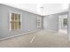 Well-lit bedroom featuring neutral walls and carpet at 1721 Telfair Chase Way, Lawrenceville, GA 30043