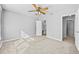 Bright bedroom featuring ceiling fan and en-suite bathroom at 1721 Telfair Chase Way, Lawrenceville, GA 30043