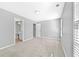 Bright bedroom with neutral walls and carpet at 1721 Telfair Chase Way, Lawrenceville, GA 30043