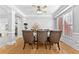 Bright dining room features hardwood floors and a view into the kitchen at 1721 Telfair Chase Way, Lawrenceville, GA 30043