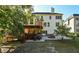 Back of house with deck, patio, and fire pit; landscapped yard at 1721 Telfair Chase Way, Lawrenceville, GA 30043