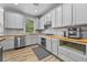 Modern kitchen with stainless steel appliances and wood flooring at 1721 Telfair Chase Way, Lawrenceville, GA 30043