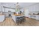 Modern kitchen with island, stainless steel appliances, and wood flooring at 1721 Telfair Chase Way, Lawrenceville, GA 30043