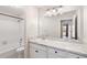 Bathroom featuring a marble countertop and a large mirror at 201 Granville Ct, Atlanta, GA 30328