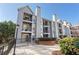 Apartment building showcasing exterior with balconies, chimneys, and well-maintained grounds at 201 Granville Ct, Atlanta, GA 30328