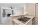 View of the kitchen, looking into living room with fireplace and hardwood floors at 201 Granville Ct, Atlanta, GA 30328