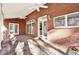 Brick back porch with natural lighting, views, and shade, perfect for outdoor enjoyment at 271 Brooks Rackley Rd, Dallas, GA 30157