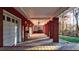 Basement covered patio featuring ceiling fans, lights and brick support columns at 271 Brooks Rackley Rd, Dallas, GA 30157