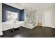 Elegant bathroom featuring a clawfoot tub, glass-enclosed shower, and stylish dark wood flooring at 271 Brooks Rackley Rd, Dallas, GA 30157