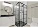 Modern bathroom with a black framed shower, vanity, and black fixtures at 271 Brooks Rackley Rd, Dallas, GA 30157