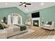 Main bedroom features a fireplace, TV, and a large window with backyard views at 271 Brooks Rackley Rd, Dallas, GA 30157